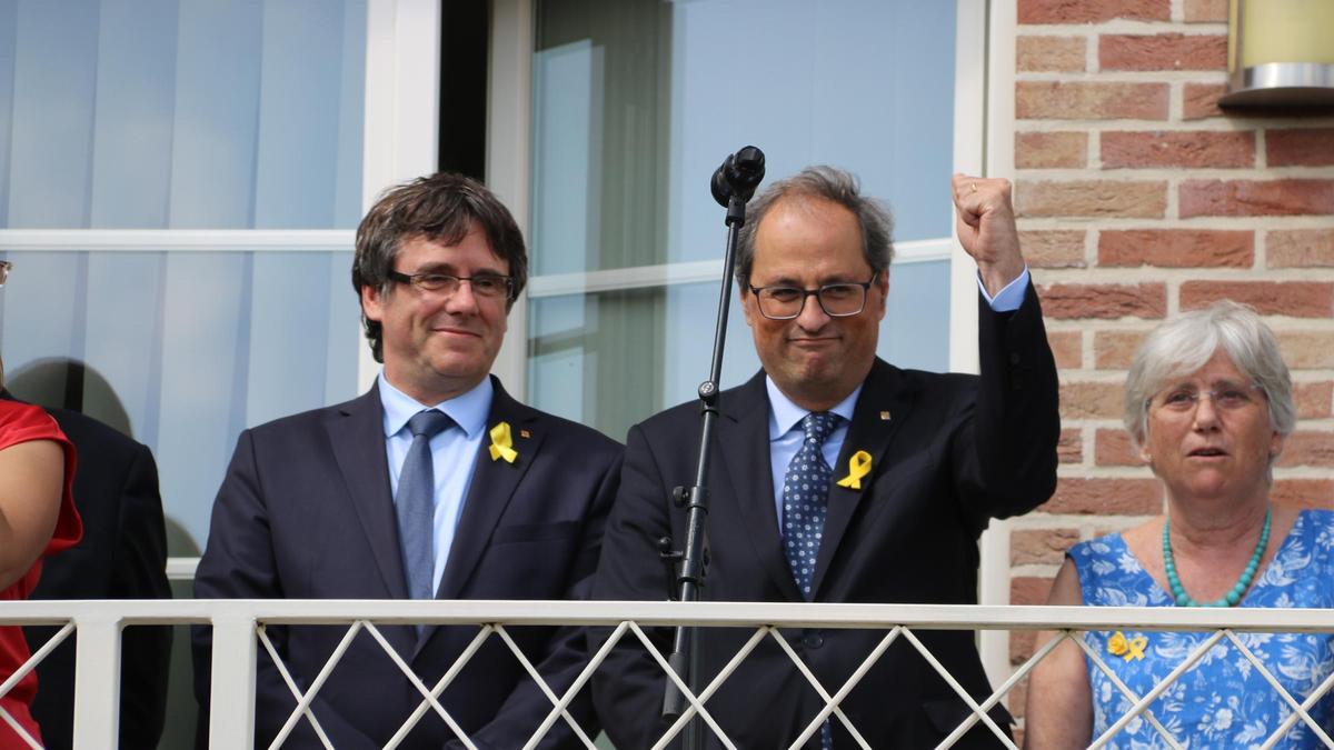 Puigdemont y Torra, durante un acto celebrado en Waterloo (Bélgica), en 2018.