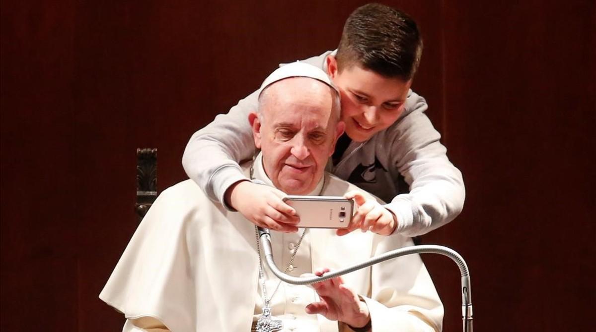 jgblanco37369278 a boy takes selfies with pope francis during a visit at the 170220105123