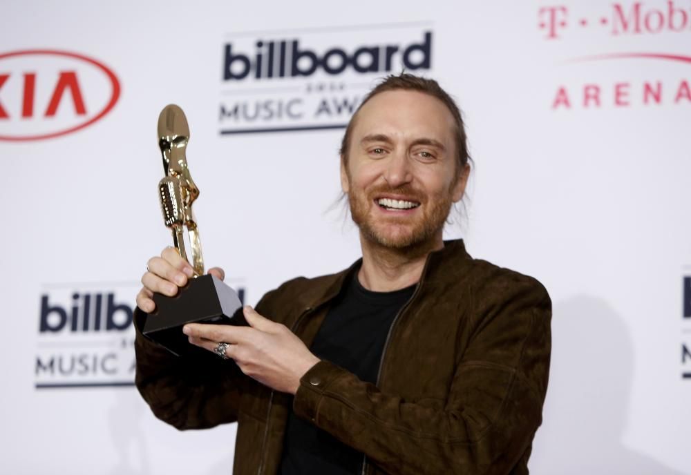 Musician David Guetta poses backstage with his ...