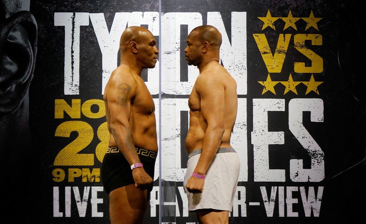 Nov 27, 2020; Los Angeles, CA, USA; Mike Tyson and Roy Jones, Jr. face off during weigh ins for a heavyweight exhibition boxing bout for the WBC Frontline Belt in Los Angeles.  Mandatory Credit: Lynn Millspaugh/Handout Photo via USA TODAY Sports     TPX IMAGES OF THE DAY