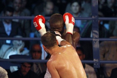 Afghan World Boxing Union champion Hamid Rahimi punches his competitor Said Mbelwa of Tanzania during their World Boxing Organization Intercontinental middleweight fight in Kabul