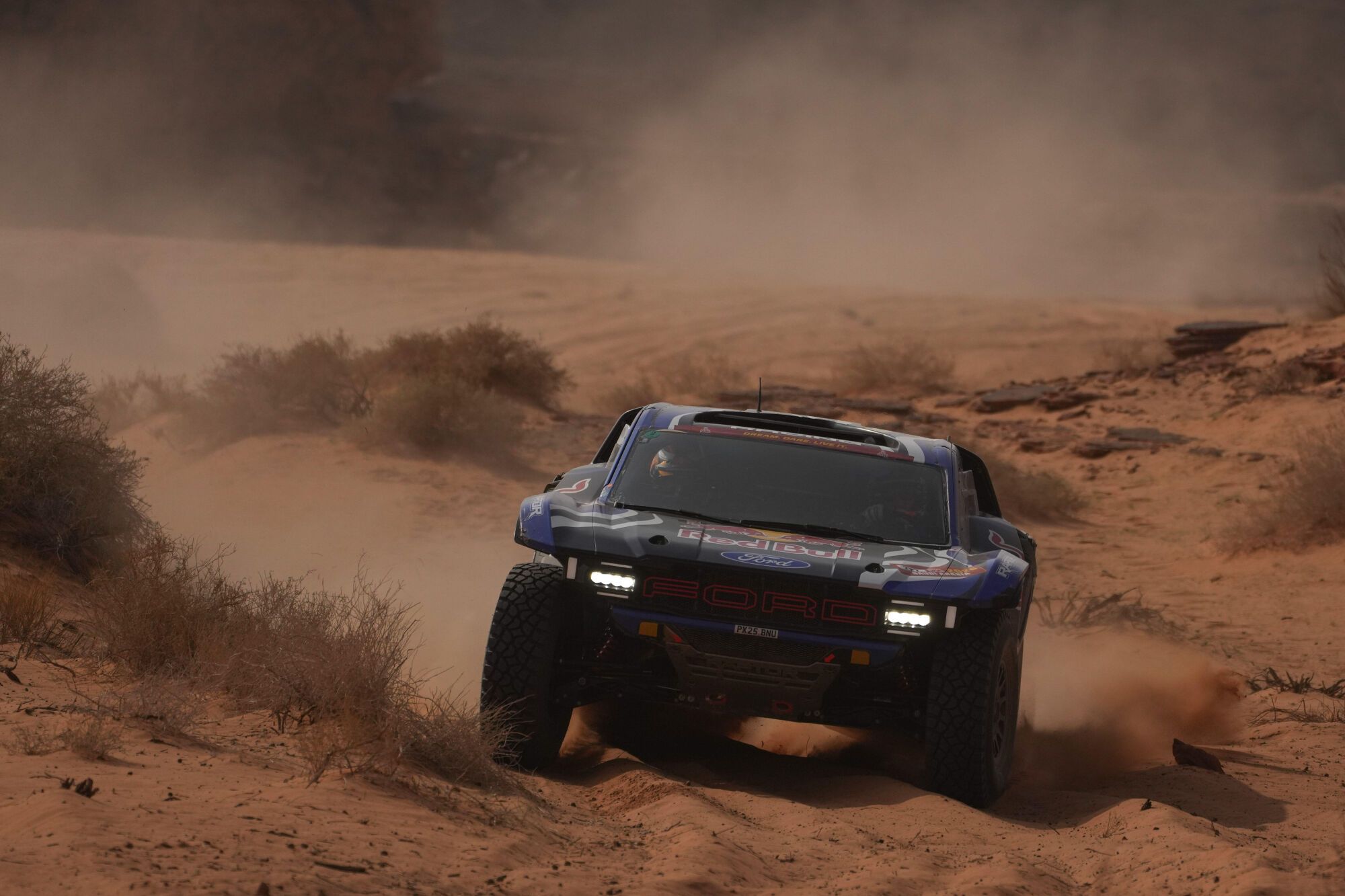 Driver Mitch Guthrie and co-driver Kellon Walsh compete during the third stage of the Dakar Rally with a start and finish in Alula, Saudi Arabia, Tuesday, Jan. 6, 2026. (AP Photo/Thibault Camus)