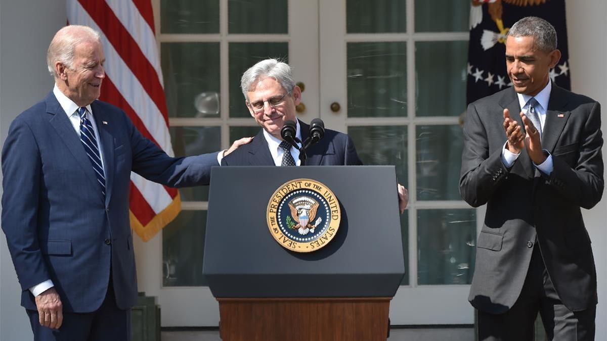 (FILES) In this file photo taken on March 16  2016  Judge Merrick Garland (C) speaks after US President Barack Obama  with Vice President Joe Biden (L)  announced Garland s nomination to the US Supreme Court  in the Rose Garden at the White House in Washington  DC  - President-elect Joe Biden has selected Garland as his attorney general  officials familiar with the selection process said on January 6  2021  Biden is expected to announce Garland s appointment on January 7  (Photo by Nicholas Kamm   AFP)