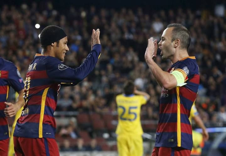 Barcelona's Neymar and Iniesta celebrate a goal against Bate Borisov during their Champions League soccer match at Camp Nou stadium in Barcelona
