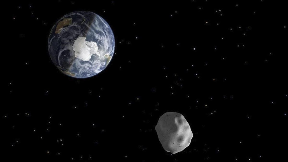 Imagen de una recreación distribuida por la NASA en febrero de 2013 que representa el paso del asteroide '2012 DA14' a través del sistema Tierra-Luna.