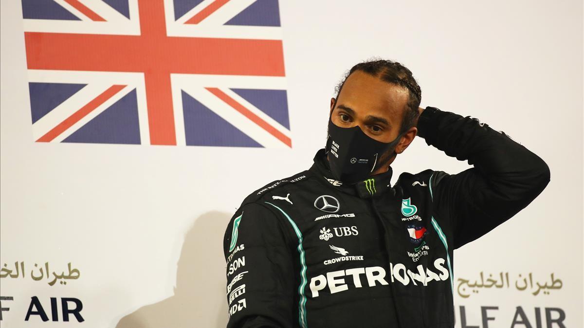 FILE PHOTO  Formula One F1 - Bahrain Grand Prix - Bahrain International Circuit  Sakhir  Bahrain - November 29  2020 Mercedes  Lewis Hamilton celebrates on the podium after winning the race Pool via REUTERS Bryn Lennon File Photo