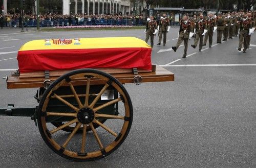 A horse-drawn carriage carries the coffin of Spain's former Prime Minister Adolfo Suarez during his funeral procession in Madrid
