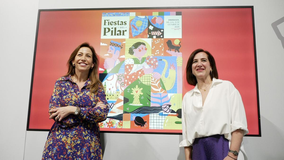 Natalia Chueca y Sara Fernández con el cartel ganador, obra de Vera Galindo.