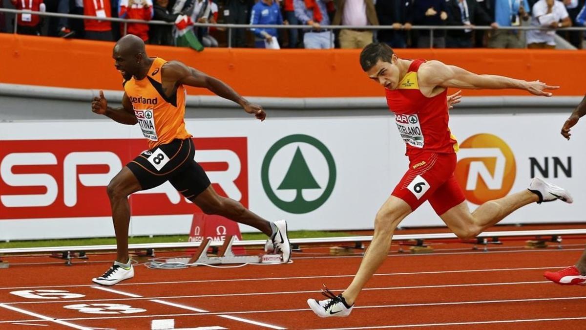 Churandy Martina cruza la meta por delante de Bruno Hortelano en la final de 200 metros.