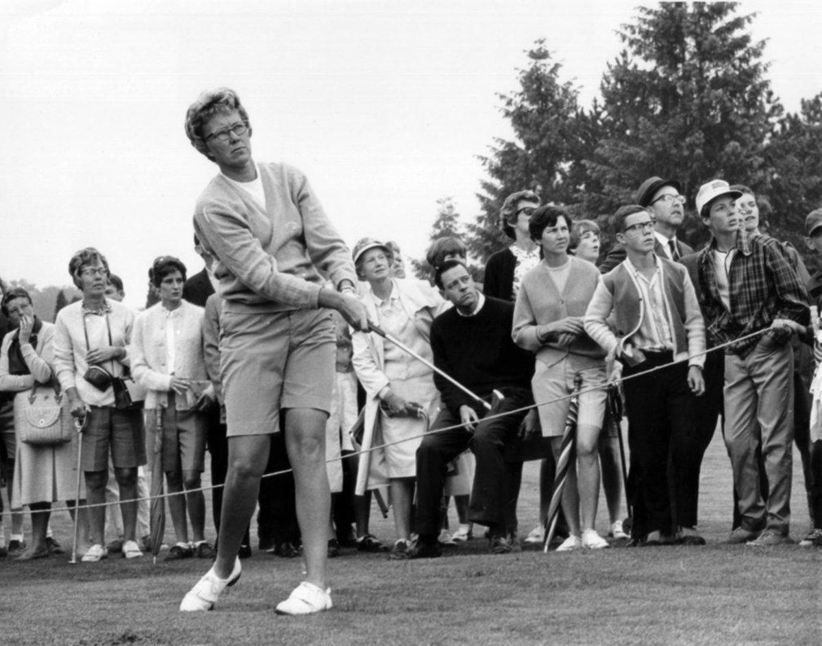 FILE - In this  1967 file photo, the gallery follows Mickey Wright’s iron shot from the fairway at the Toronto Golf Club. Hall of Fame golfer Wright, who won 82 LPGA tournaments including 13 majors, died Monday, Feb. 17, 2020, of a heart attack, her attorney said. Wright was 85. (AP Photo, File)