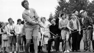 FILE - In this  1967 file photo, the gallery follows Mickey Wright’s iron shot from the fairway at the Toronto Golf Club. Hall of Fame golfer Wright, who won 82 LPGA tournaments including 13 majors, died Monday, Feb. 17, 2020, of a heart attack, her attorney said. Wright was 85. (AP Photo, File)