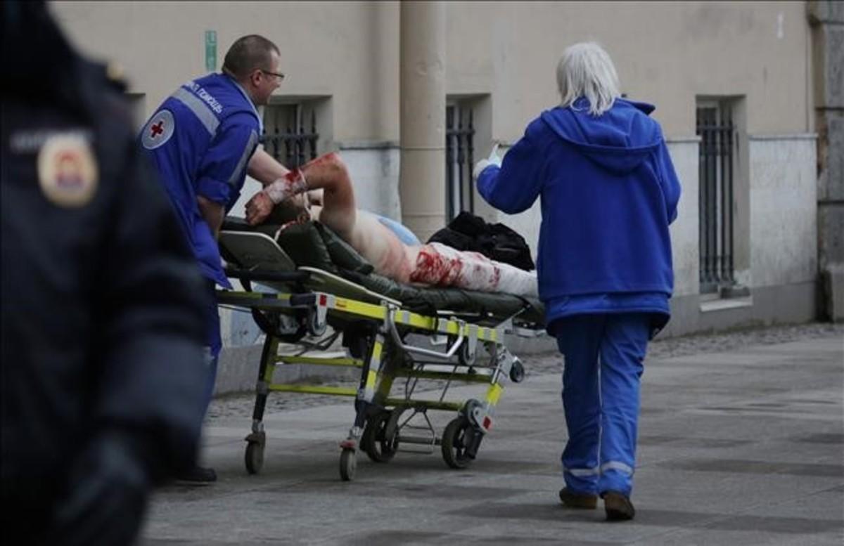 abertran37915590 an injured person is helped by emergency services outside se170403151357