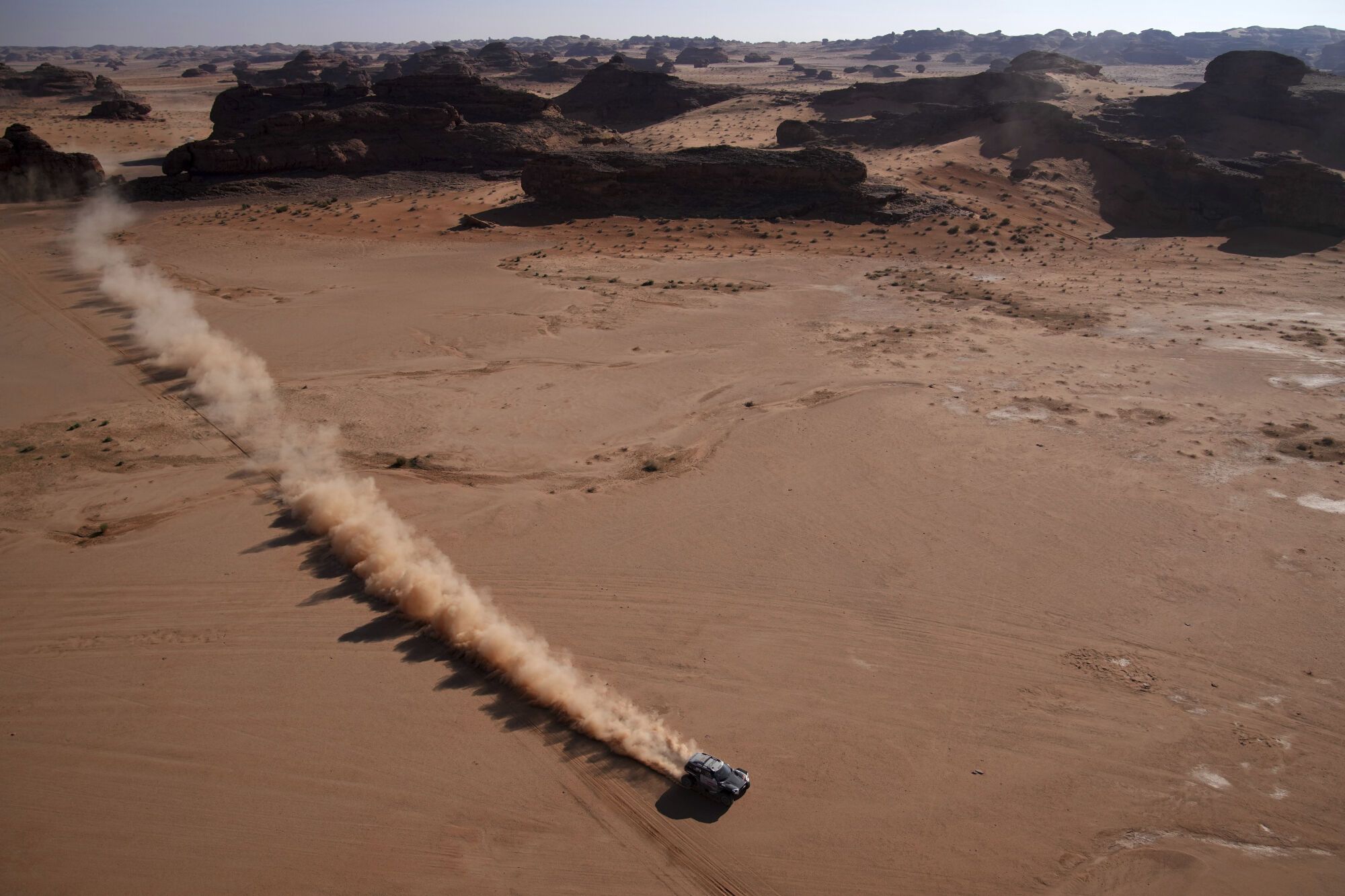 Driver Guerlain Chicherit and co-driver Alex Winocq compete during the fourth stage of the Dakar Rally between Al Henakiyah and Alula, Saudi Arabia, Wednesday, Jan. 8, 2025. (AP Photo/Christophe Ena)