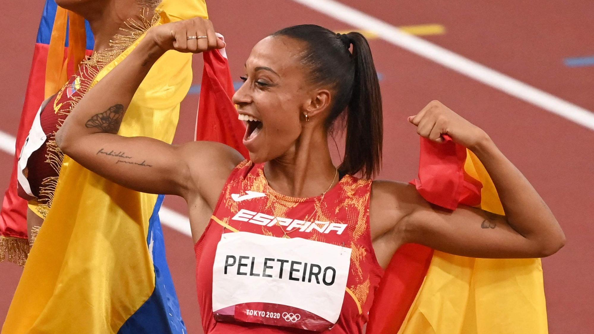 First-placed Venezuela's Yulimar Rojas (L) and third-placed Spain's Ana Peleteiro celebrate after competing in the women's triple jump final during the Tokyo 2020 Olympic Games at the Olympic Stadium in Tokyo on August 1, 2021. (Photo by Ina FASSBENDER / AFP)