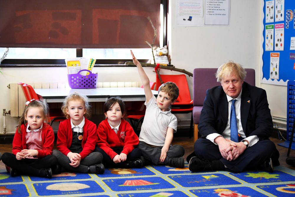 Britain's Foreign Secretary Boris Johnson sits ...