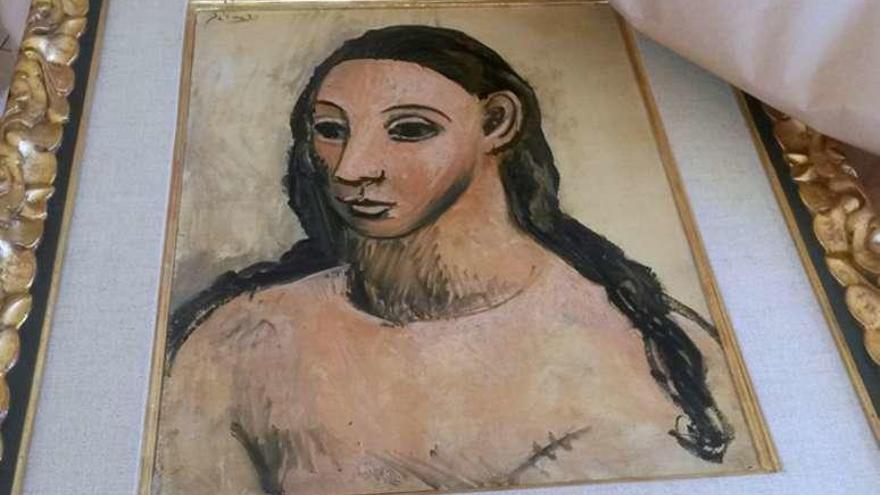 &#039;Cabeza de mujer joven&#039;, pintada por Picasso en 1906. A la derecha, Jaime Botín