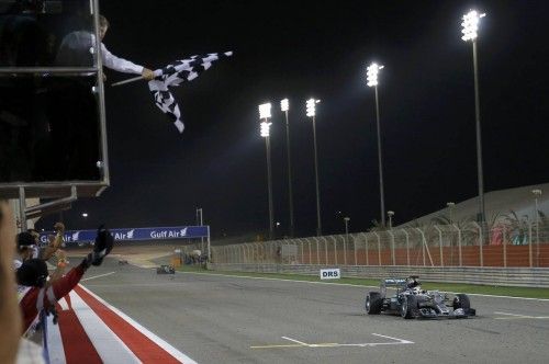 Mercedes Formula One driver Hamilton of Britain takes the chequered flag to win Bahrain's F1 Grand Prix