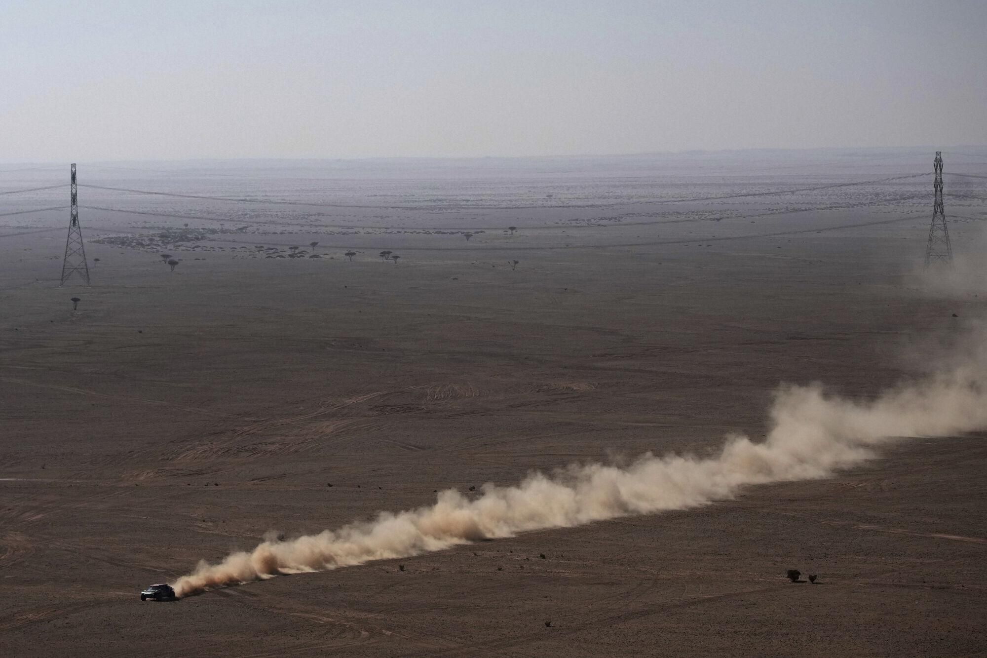 A car drives during the ninth stage of the Dakar Rally between Riyadh and Haradh, Saudi Arabia, Tuesday, Jan. 14, 2025. (AP Photo/Christophe Ena)