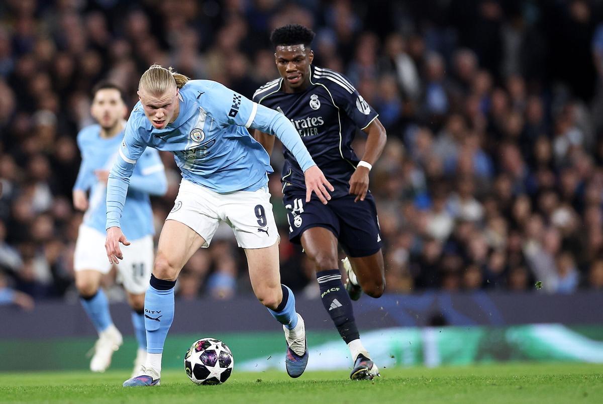 Erling Haaland, del Manchester City ante Aurelien Tchouameni, del Madrid, durante el partido de vuelta de octavos de la UEFA Champions League que han jugado Manchester City y Real Madrid en Manchester, Reino Unido. EFE/EPA/ADAM VAUGHAN. manchester city . real madrid. liga campeones 2025/2026 manchester city . real madrid. octavos vuelta. accion. etihad stadium