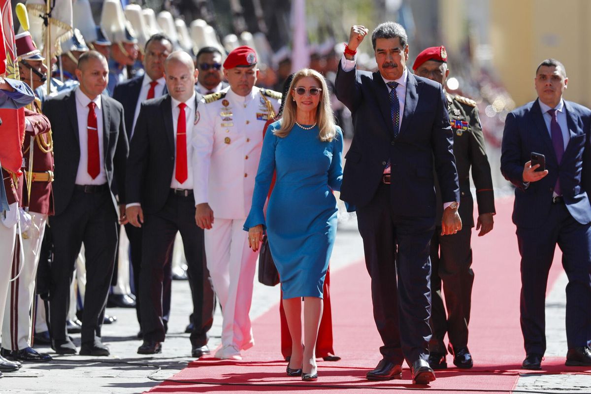 Venezuelan President Nicolas Maduro and his wife Cilia Flores arrive at the National Assembly for his swear-in ceremony for a third term in Caracas, Venezuela, Friday, Jan. 10, 2025. (AP Photo/Cristian Hernandez)