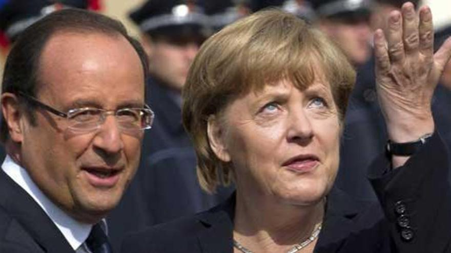 Merkel y Hollande.