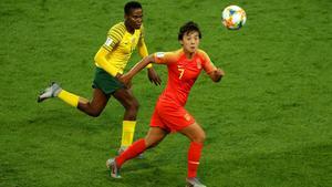PARIS, FRANCE - JUNE 13: Shuang Wang of China is challenged by Noko Matlou of South Africa during the 2019 FIFA Women’s World Cup France group B match between South Africa and China PR at Parc des Princes on June 13, 2019 in Paris, France. (Photo by Richard Heathcote/Getty Images)