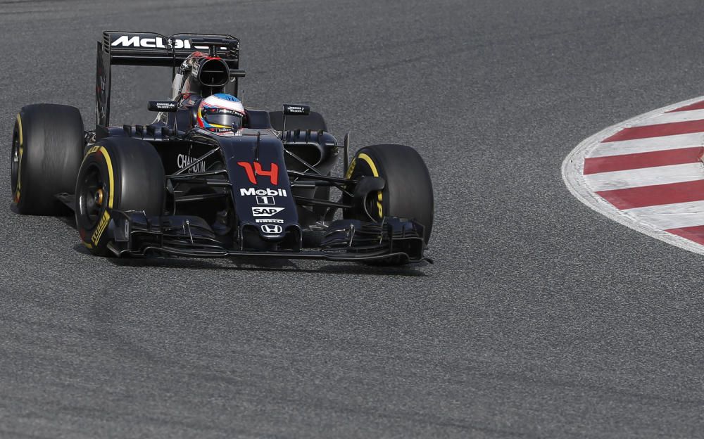 McLaren Formula One driver Alonso of Spain takes ...