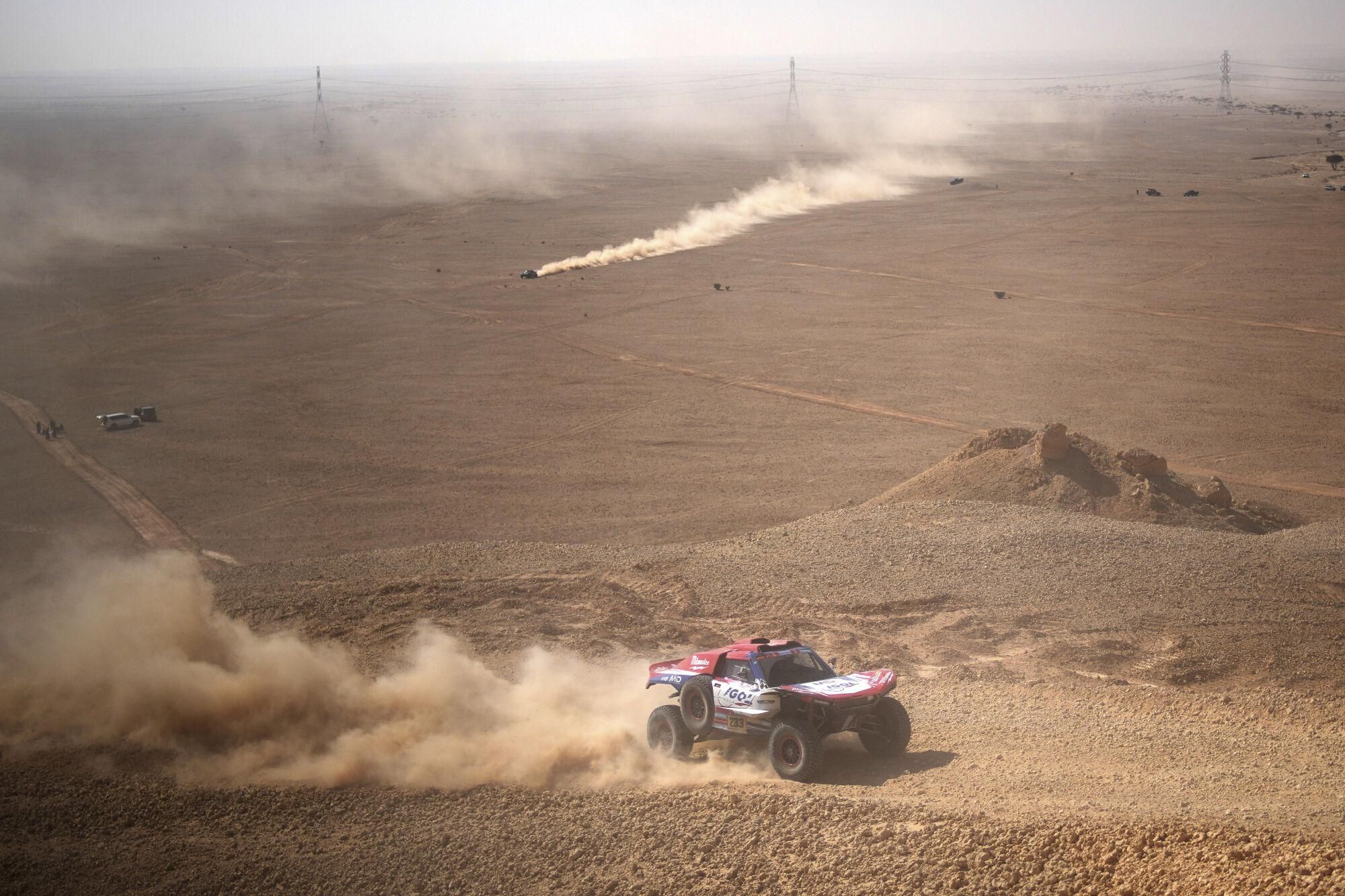 Driver Simon Vitse and co-driver Max Delfino compete during the ninth stage of the Dakar Rally between Riyadh and Haradh, Saudi Arabia, Tuesday, Jan. 14, 2025. (AP Photo/Christophe Ena)