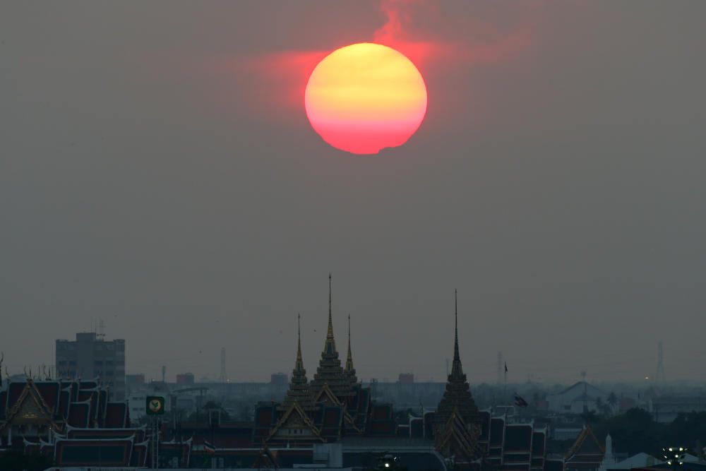 Sunset is seen near the Grand Palace in Bangkok