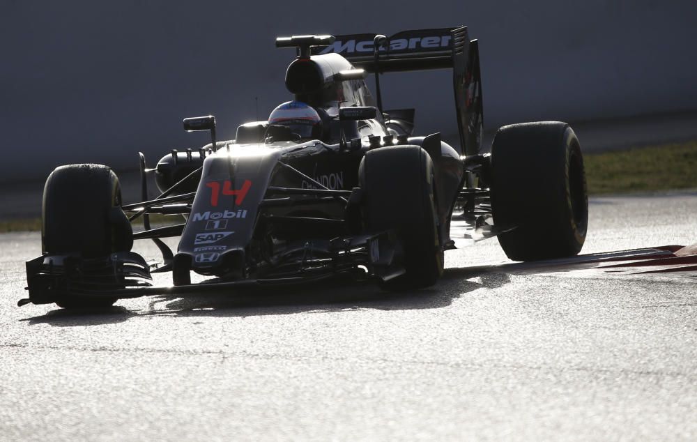 McLaren Formula One driver Alonso of Spain takes ...