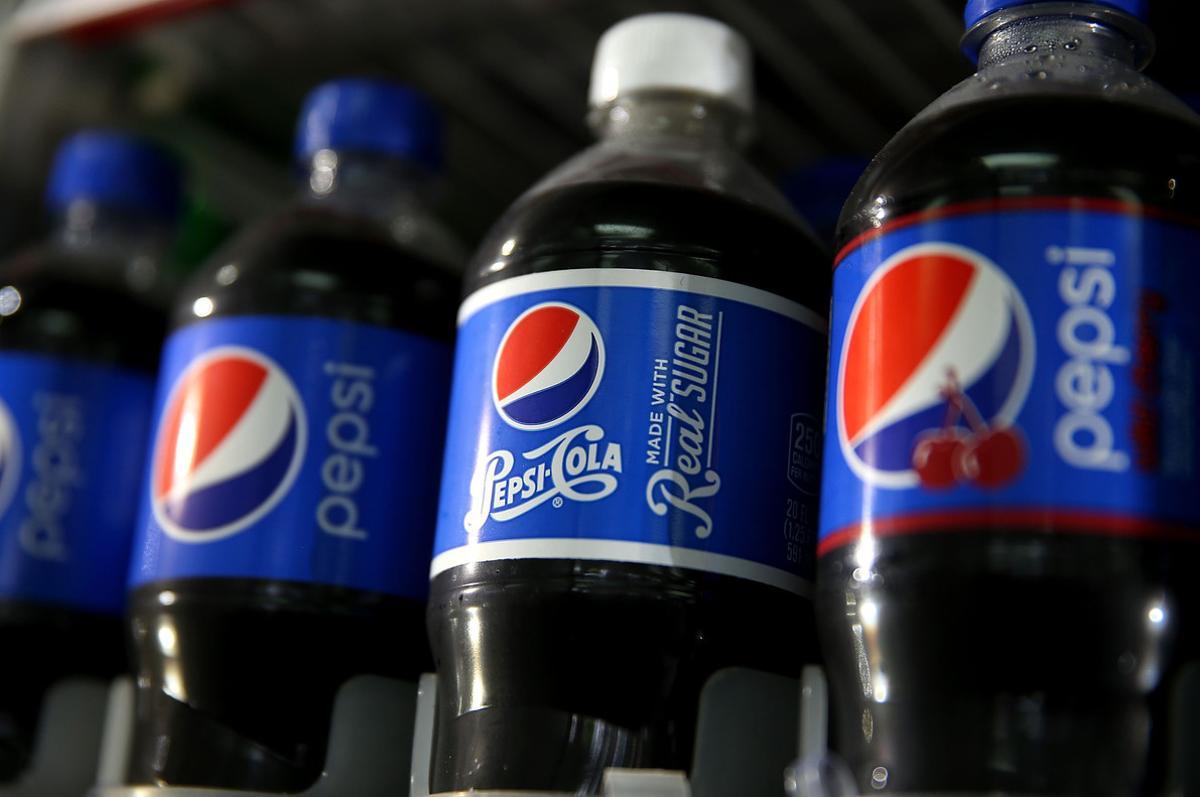 (FILES) This file photo taken on July 9, 2015 shows bottles of Pepsi displayed in a cooler at a convenience store in San Francisco, California.