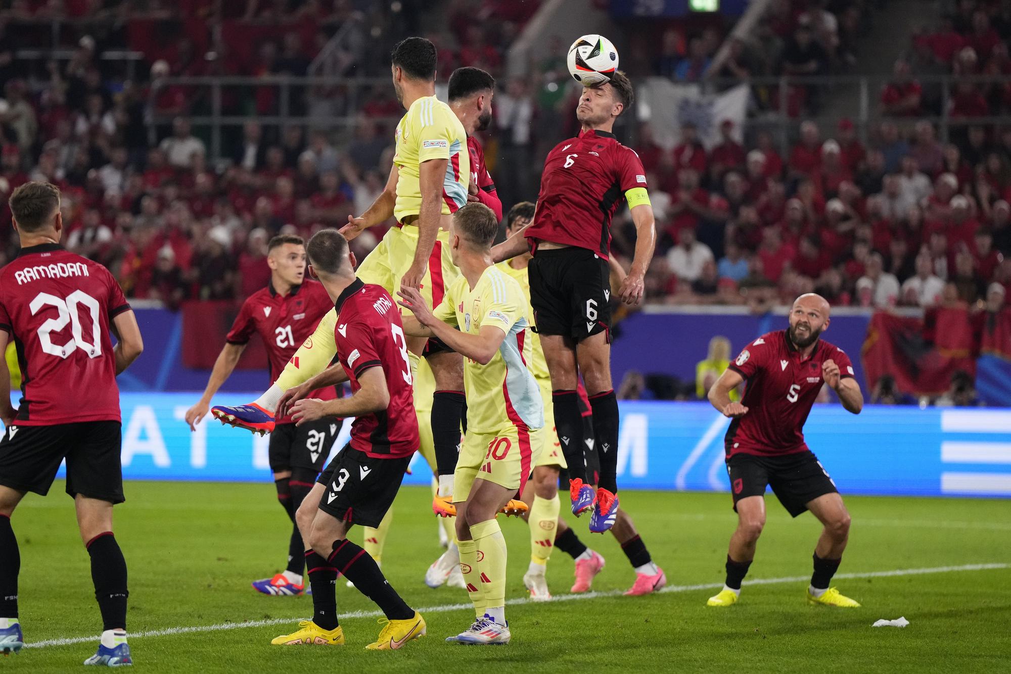 Albania's Berat Djimsiti, center, heads the ball during a Group B match between Albania and Spain at the Euro 2024 soccer tournament in Duesseldorf, Germany, Monday, June 24, 2024. Spain won 1-0. (AP Photo/Manu Fernandez)