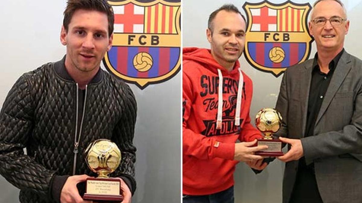 Leo Messi y Andrés Iniesta recibieron sus premios de manos de Robert Ley