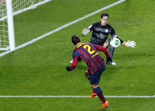 Barcelona's Martin Montoya shoots against Levante's goalkeeper Javi Jimenez during their Spanish King's Cup soccer match at Nou Camp stadium in Barcelona