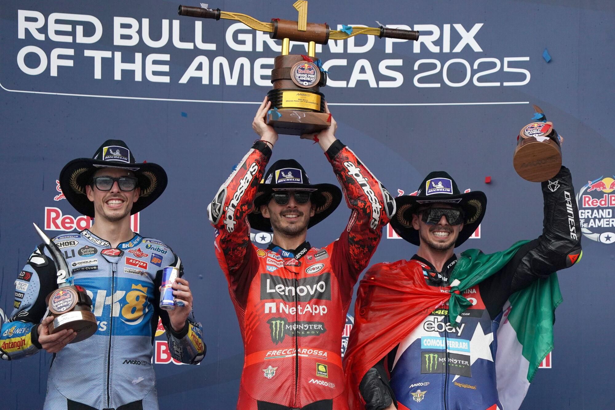 AUSTIN (United States), 30/03/2025.- Winner Francesco Bagnaia (C) of Italy, Ducati Lenovo Team, third placed Fabio Di Giannantonio (R) of Italy, Pertamina Enduro VR46 Racing Team, and second placed Alex Marquez (L) of Spain, BK8 Gresini Racing MotoGP, celebrate on the podium for the MotoGP Race of the Americas in Austin, Texas, USA, 30 March 2025. (Motociclismo, Italia, España) EFE/EPA/DUSTIN SAFRANEK