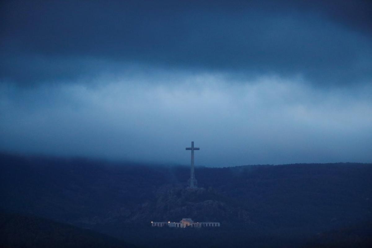 The Valle de los Caidos (The Valley of the Fallen), the state mausoleum where late Spanish dictator Francisco Franco is buried, is seen at dusk in San Lorenzo de El Escorial in this picture taken from Guadarrama, near Madrid, Spain, October 24, 2019. REUTERS/Sergio Perez