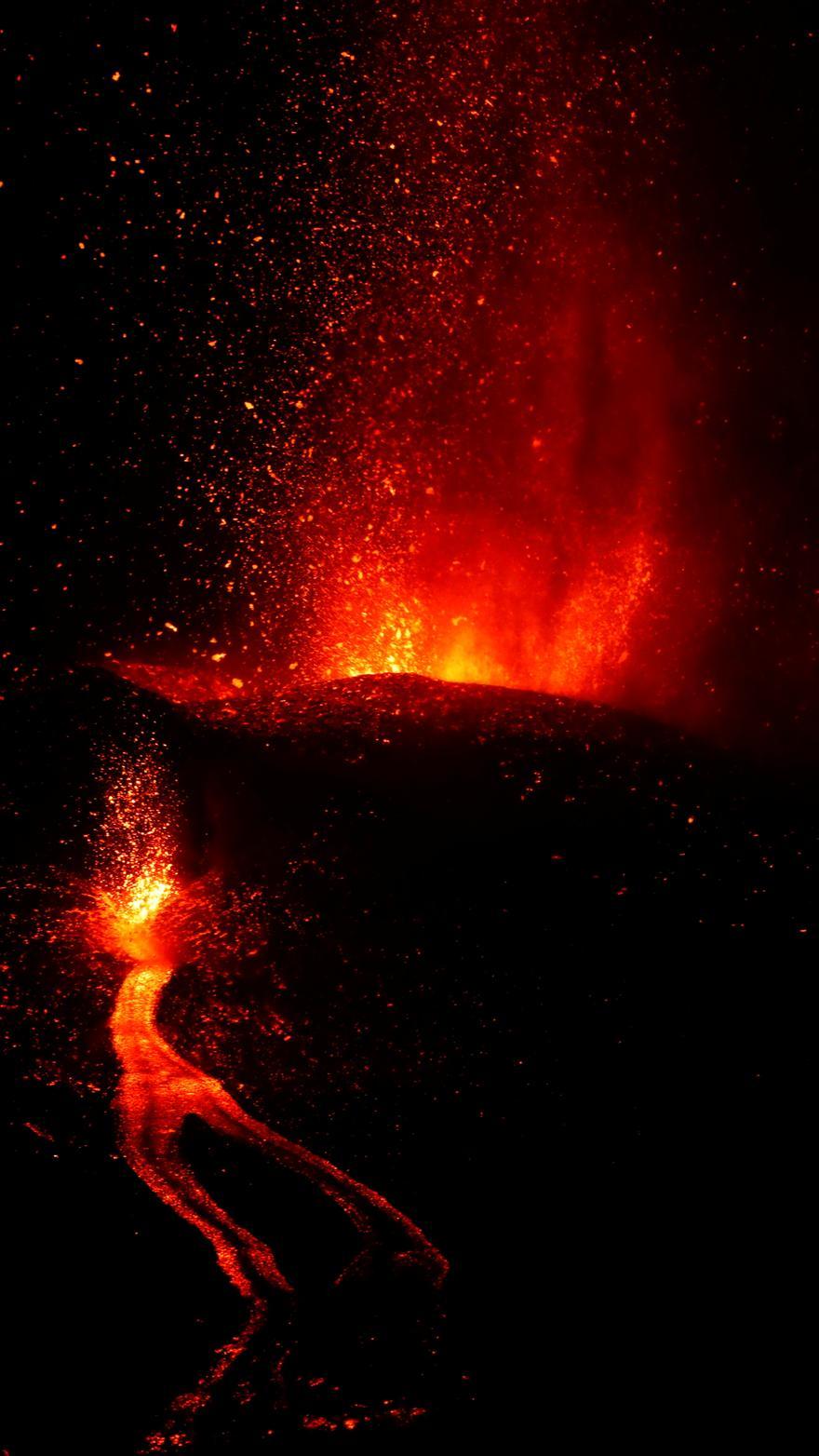 Lava and smoke rise following the eruption of a volcano on Spanish Canary Island of La Palma