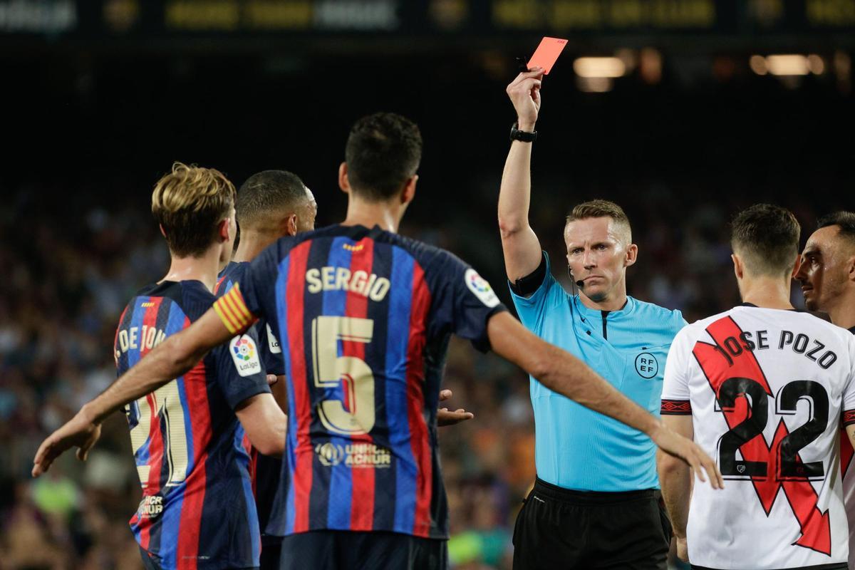 Barcelona’s Sergio Busquets (3L) is booked with a red card by the referee Hernandez Hernandez (3R) during their Spanish LaLiga soccer match between FC Barcelona and Rayo Vallecano at Spotify Camp Nou stadium in Barcelona, Catalonia, Spain, 13 August 2022. EFE/ Quique Garcia