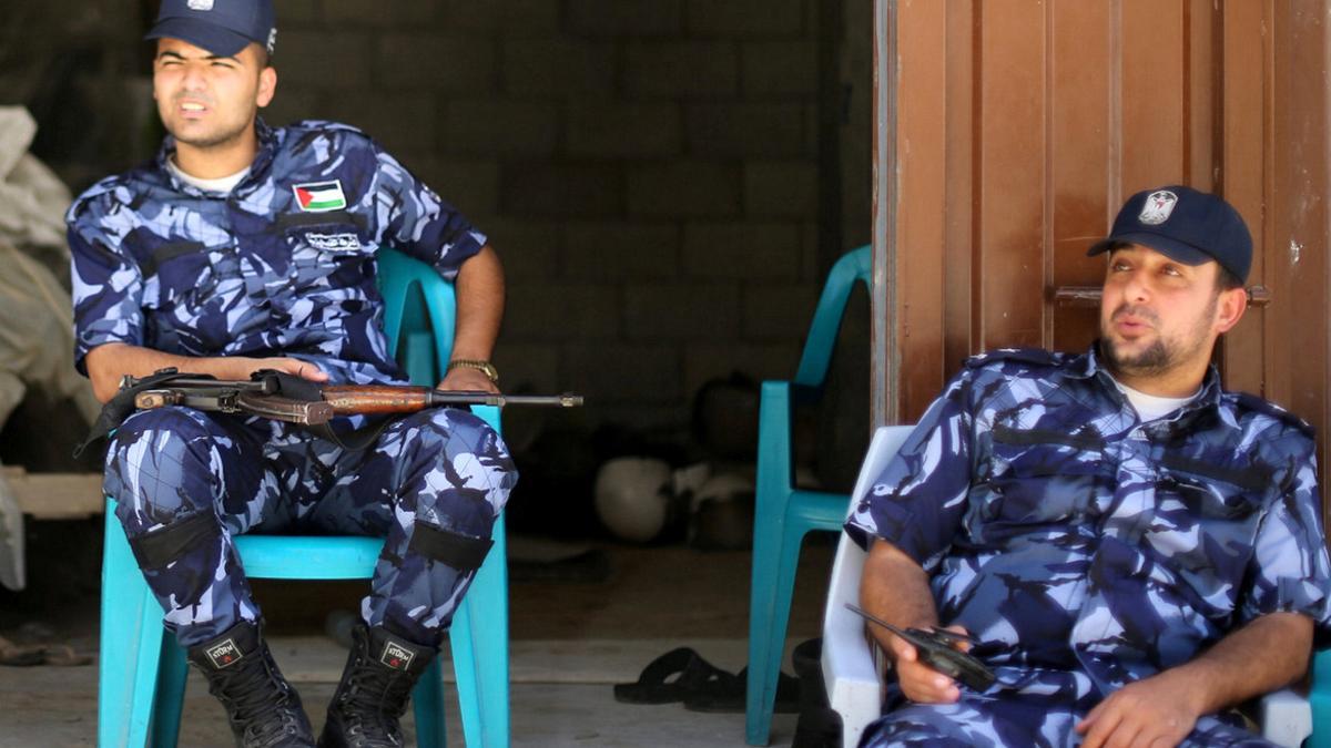 Palestinian policemen loyal to Hamas keep guard in Khan Younis in the southern Gaza Strip