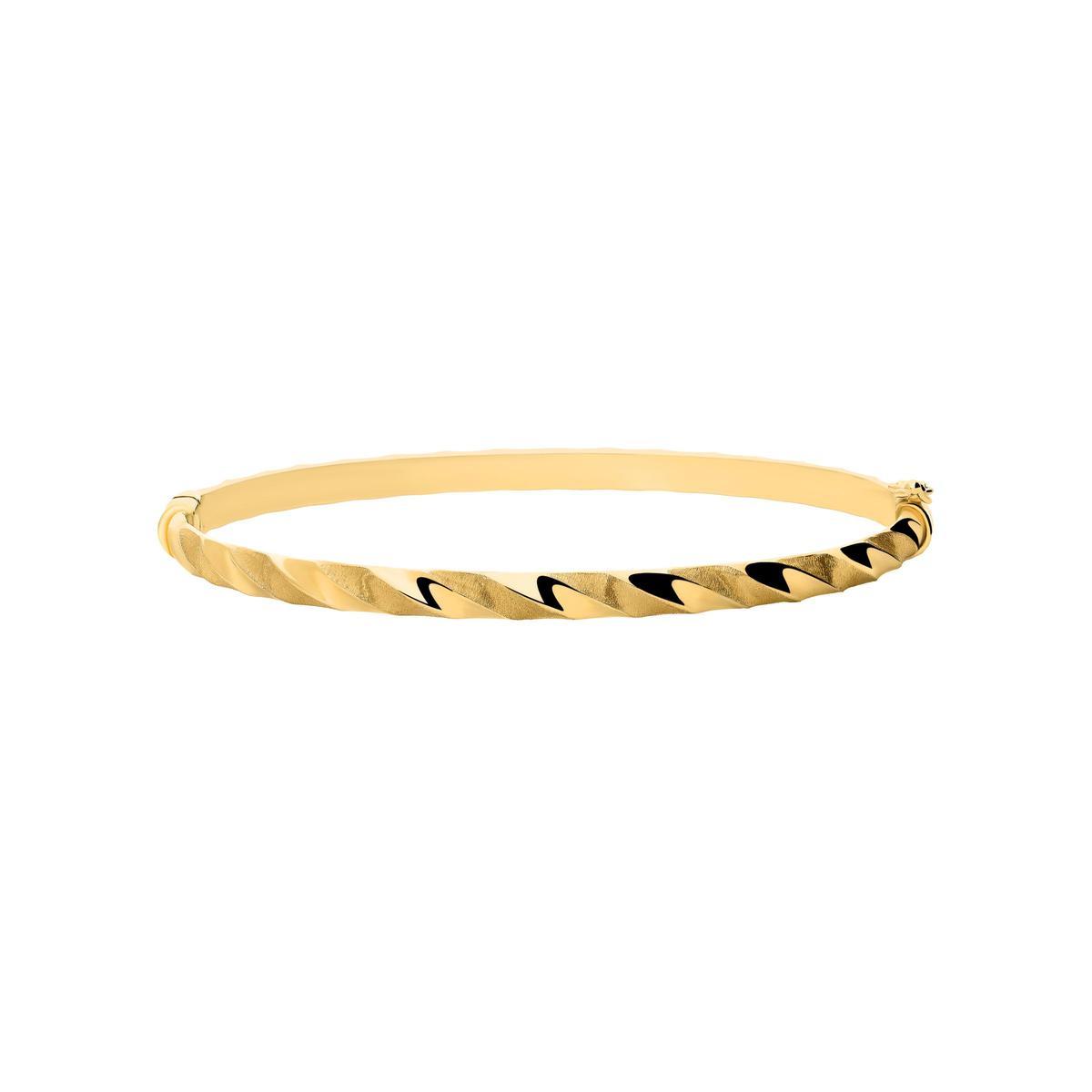 Pulsera rígida de oro de 18 quilates. (799€).