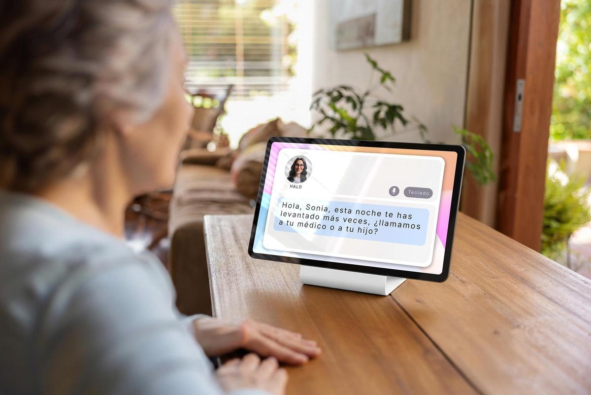 Latin American doctor talking to a senior woman at home on a video call - telemedicine concepts