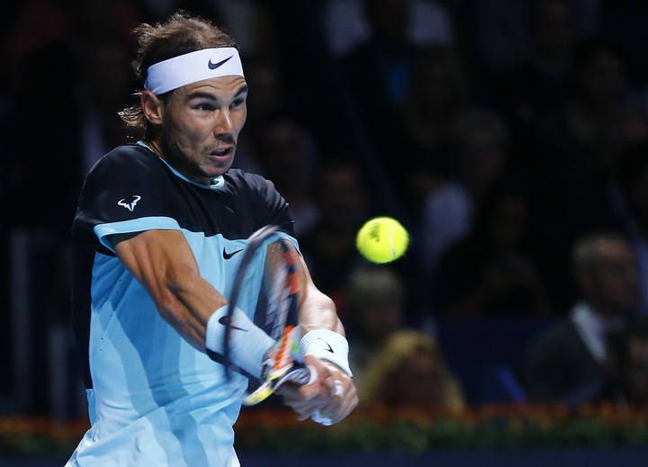 Nadal of Spain returns a ball to Switzerland's Federer during their match at the Swiss Indoors ATP men's tennis tournament in Basel