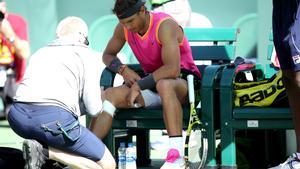 INDIAN WELLS  CALIFORNIA - MARCH 15  Rafael Nadal of Spain is tended to by a trainer during a crossover against Karen Khachanov of Russia during their men s singles quarter final match at the BNP Paribas Open at the Indian Wells Tennis Garden on March 15  2019 in Indian Wells  California    Sean M  Haffey Getty Images AFP    FOR NEWSPAPERS  INTERNET  TELCOS   TELEVISION USE ONLY