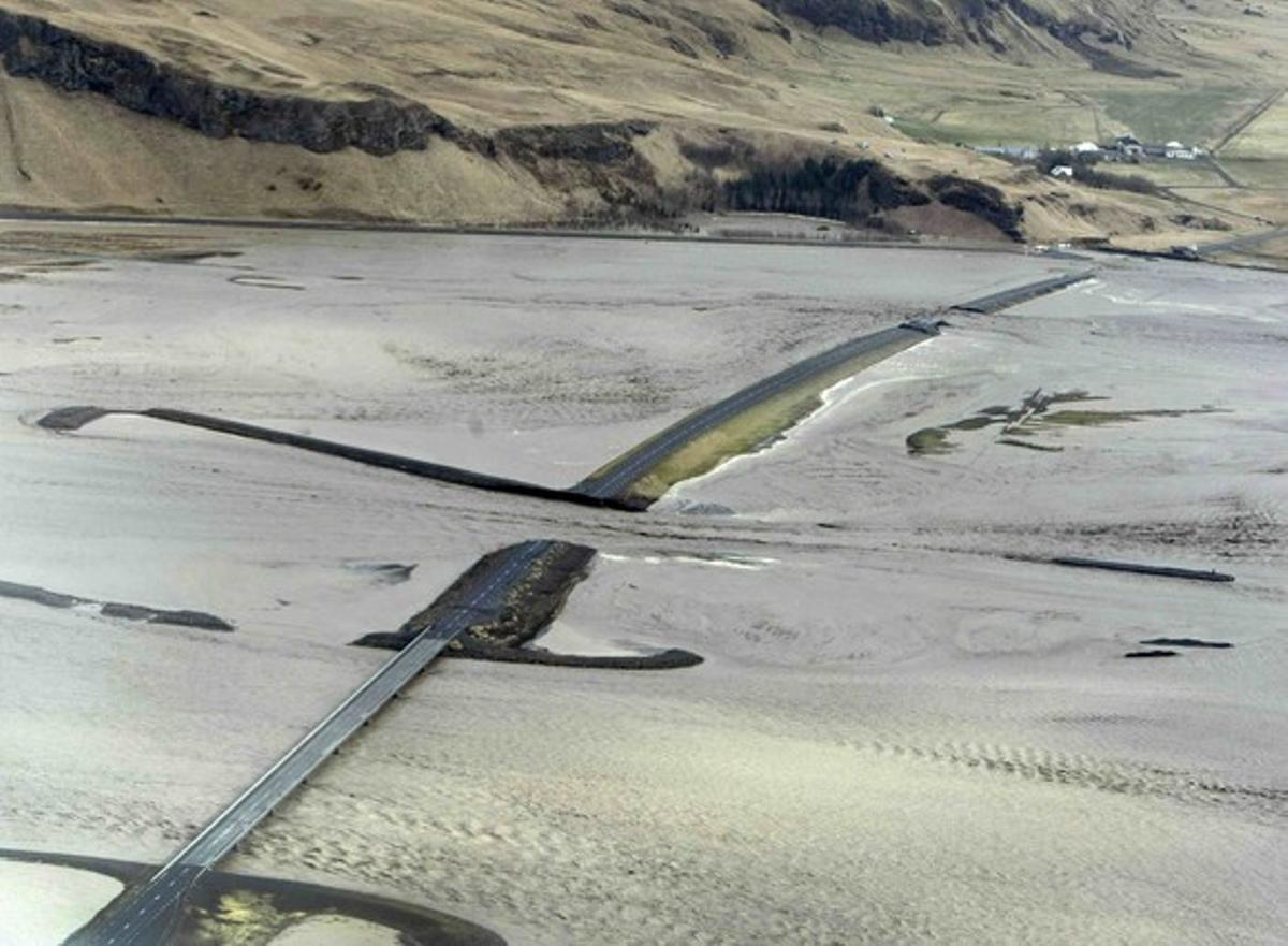 An aerial handout photo from the Icelandic Coast Guard xous Highway 1, the road that goes around Iceland, cut off by a flood caused by a volcanic eruption at Eyjafjalla Glacier