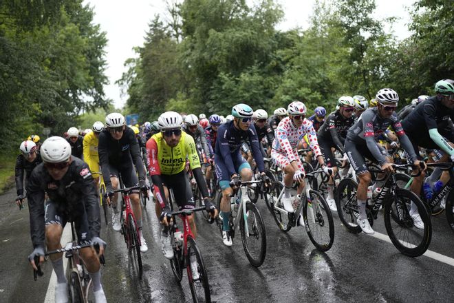 The pack with Slovenias Tadej Pogacar wearing the best climbers dotted jersey rides during the third stage of the Tour de France cycling race over 178.3 kilometers (110.8 miles) with start in Valenciennes and finish in Dunkerque, France, Monday, July 7, 2025. (AP Photo/Mosaab Elshamy)