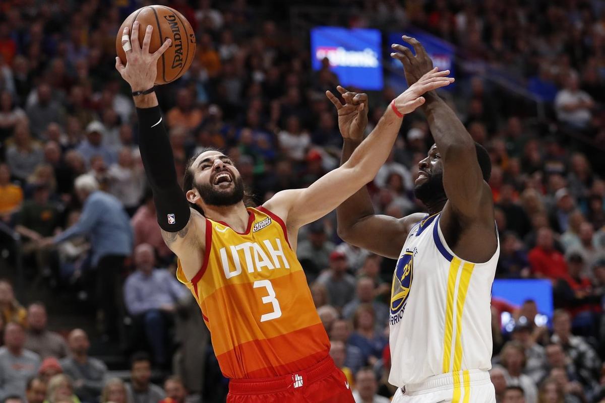 Dec 19, 2018; Salt Lake City, UT, USA; Utah Jazz guard Ricky Rubio (3) shoots against Golden State Warriors forward Draymond Green (23) in the fourth quarter at Vivint Smart Home Arena. Mandatory Credit: Jeff Swinger-USA TODAY Sports Dec 19, 2018; Salt Lake City, UT, USA; Utah Jazz guard Ricky Rubio (3) shoots against Golden State Warriors forward Draymond Green (23) in the fourth quarter at Vivint Smart Home Arena. Mandatory Credit: Jeff Swinger-USA TODAY Sports