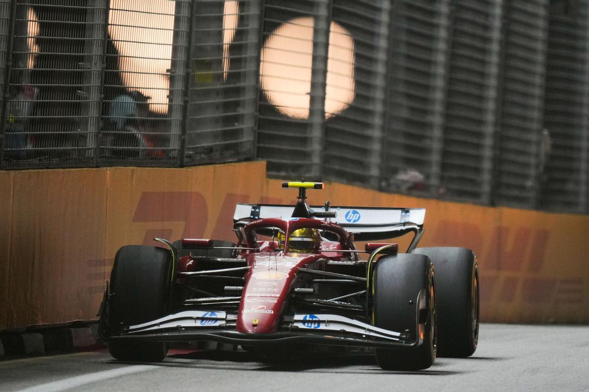 Ferrari driver Lewis Hamilton of Britain steers his car during the Singapore Formula One Grand Prix at the Marina Bay Street Circuit in Singapore, Sunday, Oct. 5, 2025. (AP Photo/Vincent Thian)
