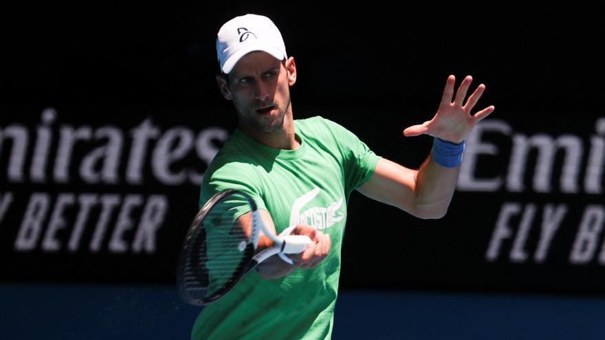 Serbian tennis player Novak Djokovic practices at Melbourne Park as questions remain over the legal battle regarding his visa to play in the Australian Open