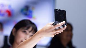 An attendee looks at a Samsung Galaxy Z Flip 8 smartphone at Samsung Electronics Co., at a Samsung Unpacked launch event in London, UK, on Wednesday, July 22, 2026. Samsung Electronics Co. revamped its foldable phone lineup, introducing a new entertainment-focused model that will compete with Apple Inc.s imminent entry into the market. Photographer: Chris Ratcliffe/Bloomberg