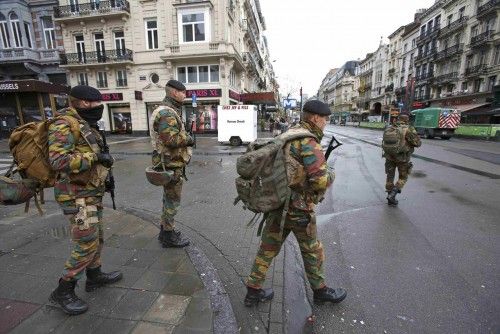 Belgian soldiers patrol in central Brussels after security was tightened in Belgium following the fatal attacks in Paris
